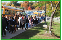 Teachers walking students to bus